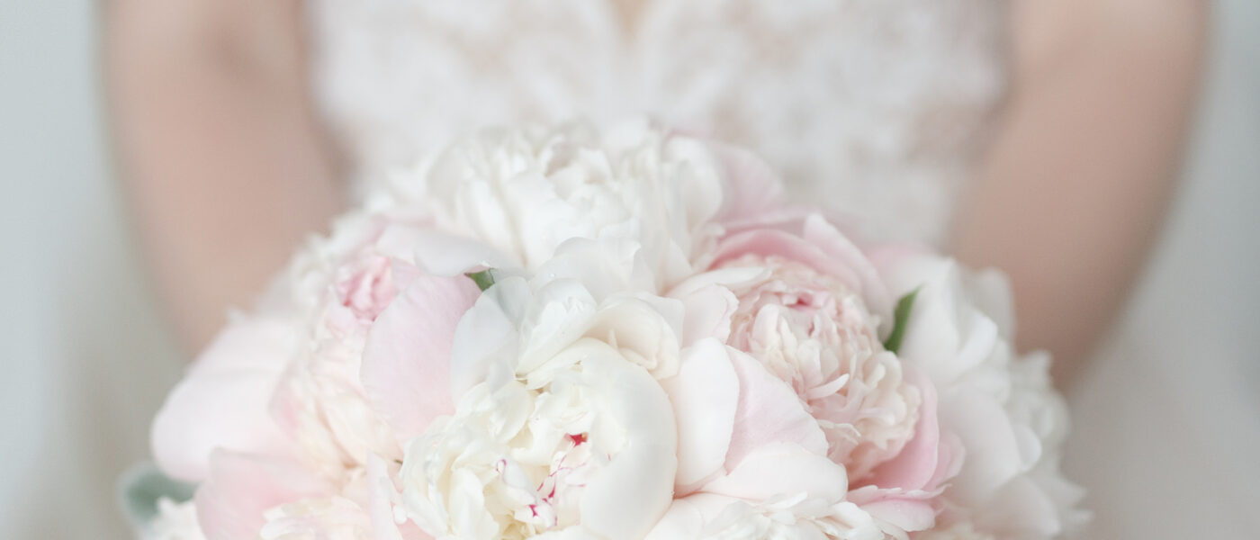 Beautiful and delicate wedding bouquet of peony roses