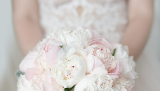 Beautiful and delicate wedding bouquet of peony roses